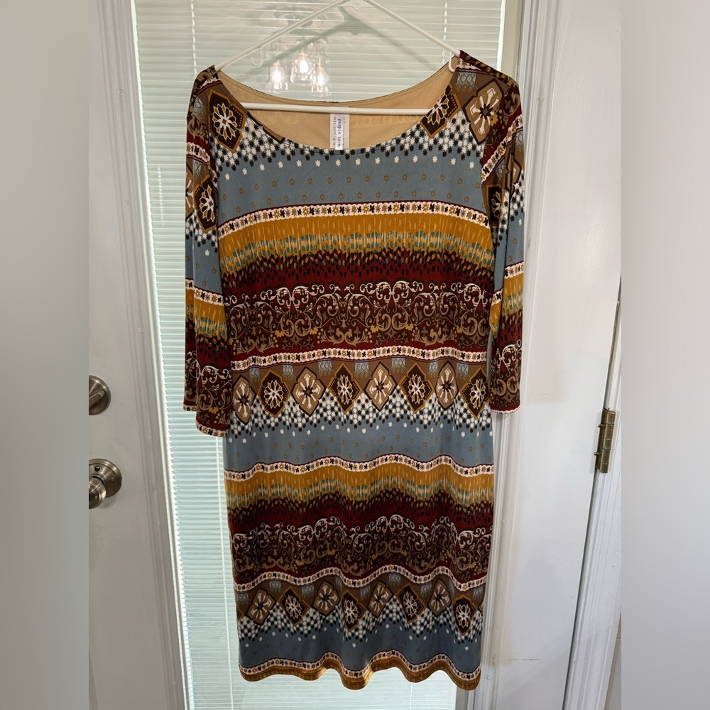 Sheath dress, size large.  Lots of rich colors and stretchy material.